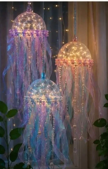 DIY glowing jellyfish lanterns made from clear plastic bowls and battery-operated lights.